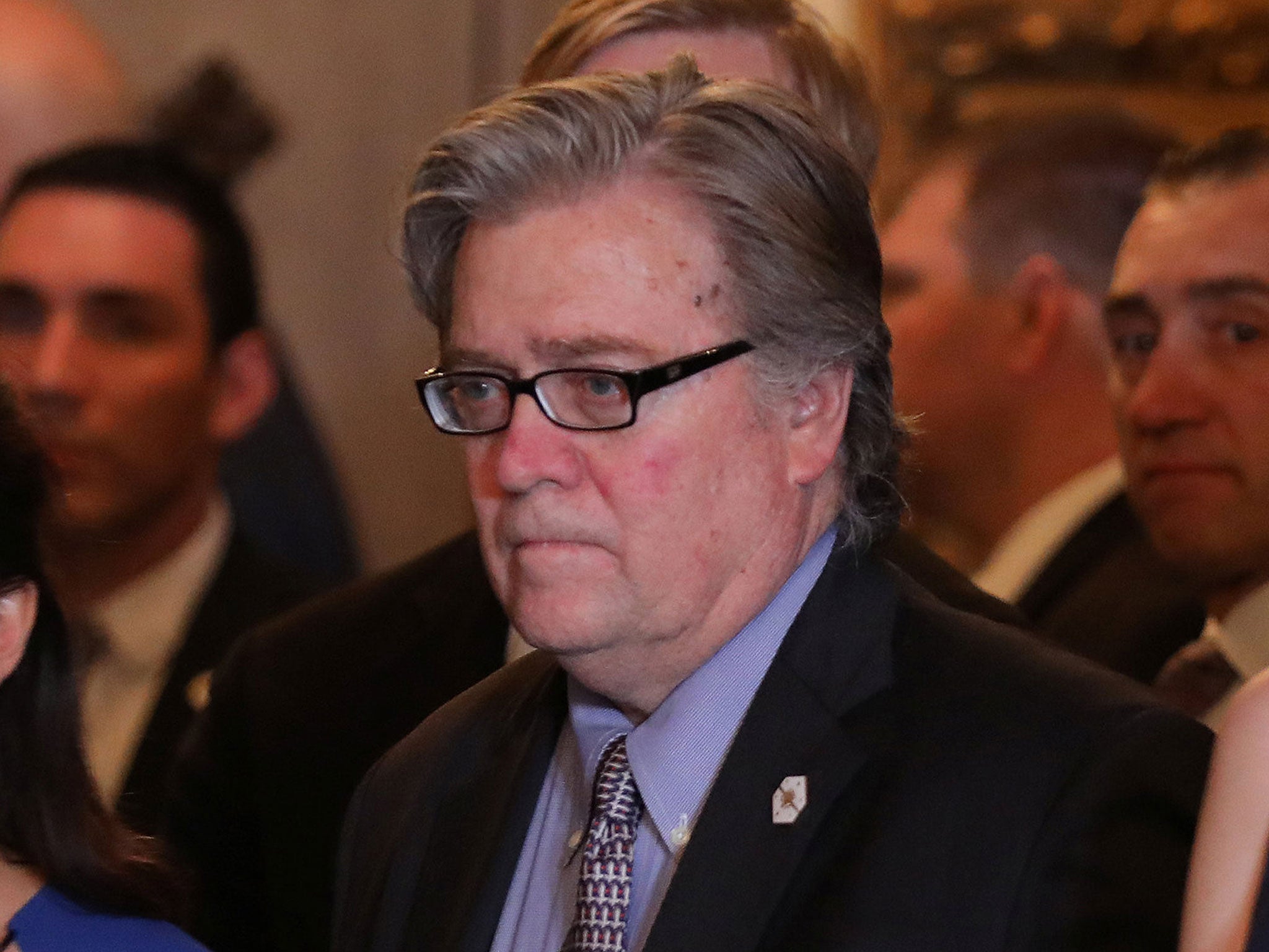 Steve Bannon listens as President Donald Trump delivers a statement about missile strikes on a Syrian airfield at the Mar-a-Lago estate in Florida