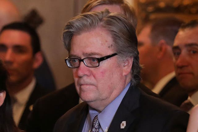 Steve Bannon listens as President Donald Trump delivers a statement about missile strikes on a Syrian airfield at the Mar-a-Lago estate in Florida