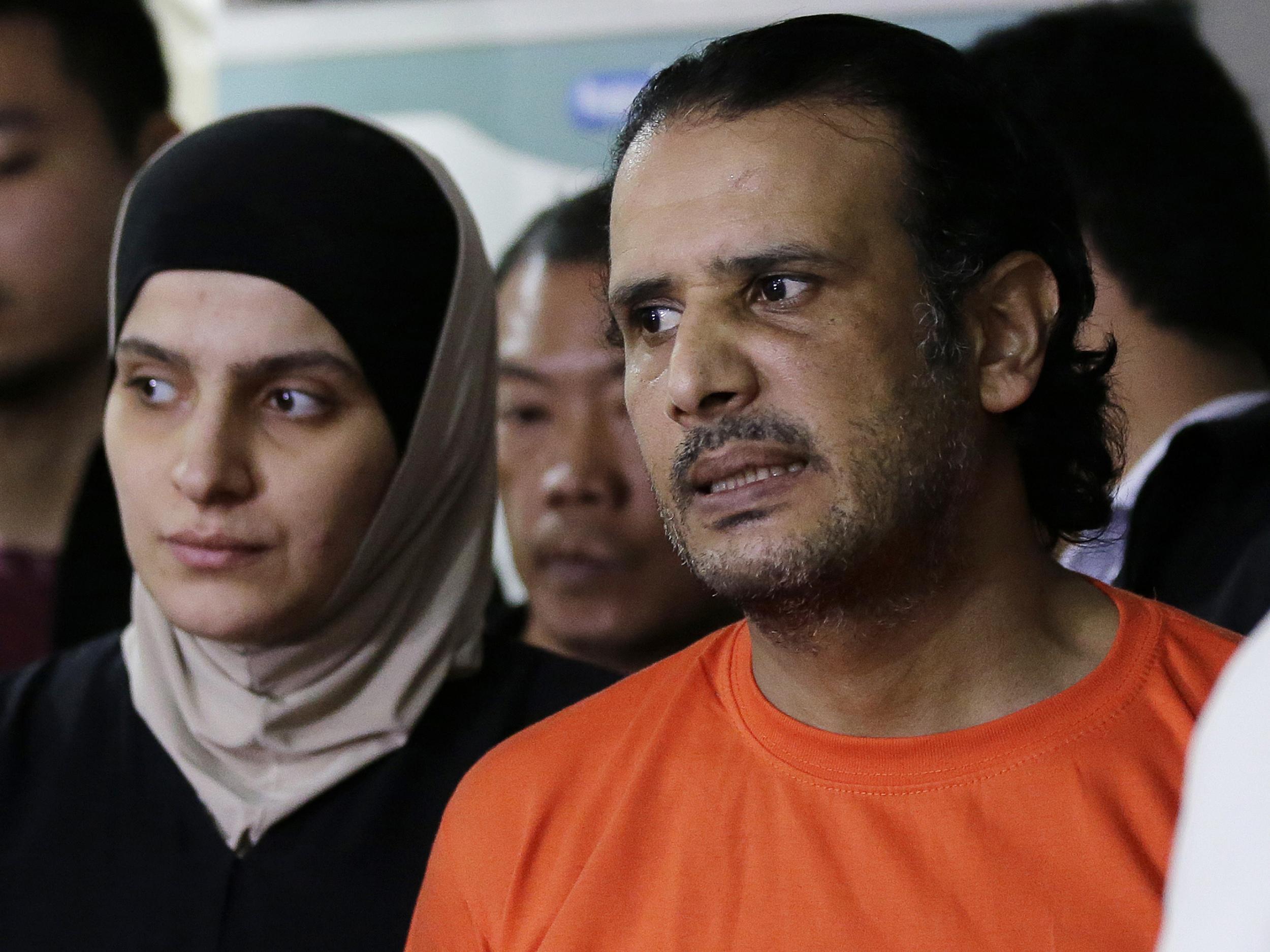 Suspected Isis members Rahaf Zina Dhafiri and Hussein Aldhafiri are presented to reporters at the National Bureau of Investigation in Manila