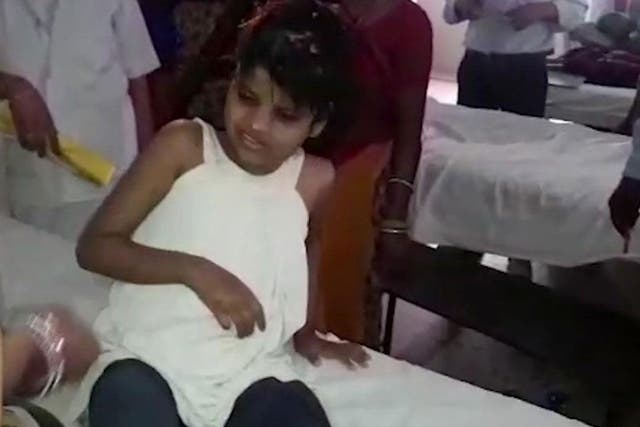 The unidentified girl is pictured in hospital where she is receiving care
