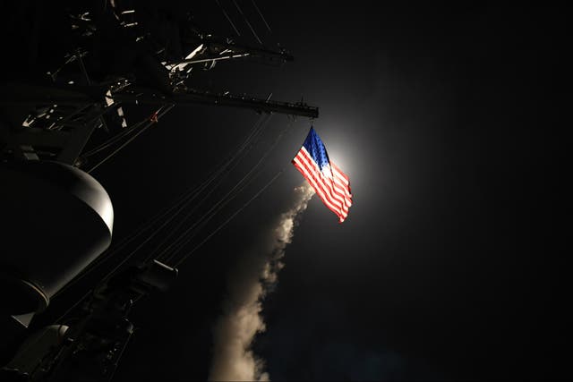 The guided-missile destroyer USS Porter fires a Tomahawk missile in the early hours of Friday