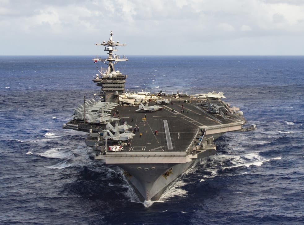 The aircraft carrier USS Carl Vinson transits the Pacific Ocean