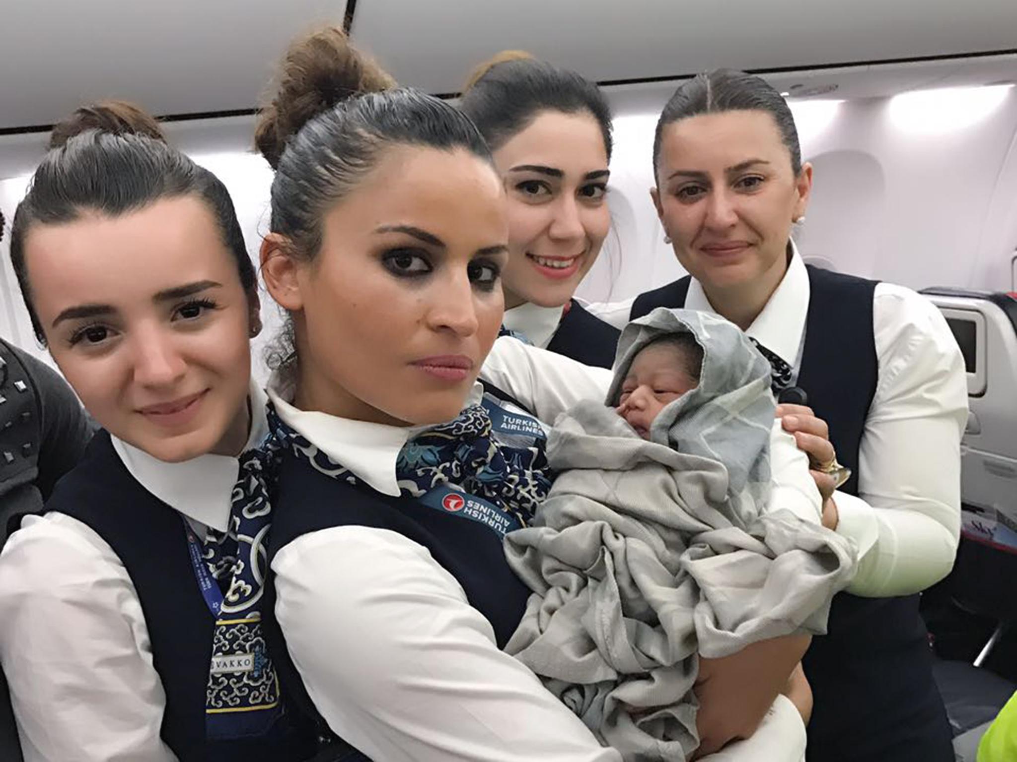 Cabin crew with baby Kadiju who was born 28 weeks premature during a flight