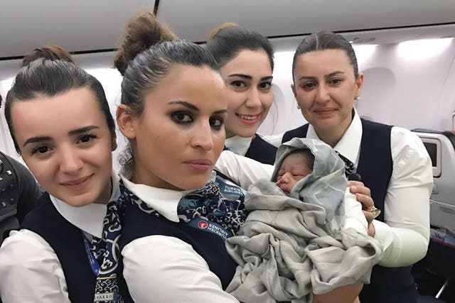 Cabin crew with baby Kadiju who was born 28 weeks premature during a flight