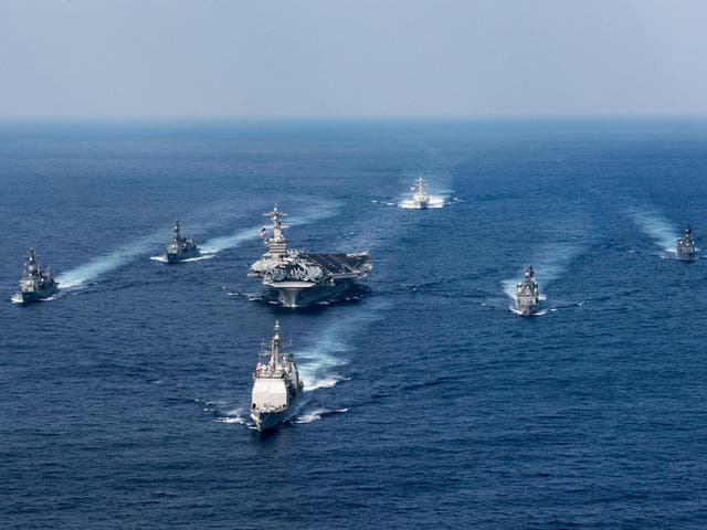 epa05898649 A handout photo made available by the US Navy on 09 April 2017 showing the US Navy aircraft carrier USS Carl Vinson (CVN 70), the guided-missile destroyer USS Wayne E. Meyer (DDG 108) and the guided-missile cruiser USS Lake Champlain (CG 57) participate in a photo exercise with Japan Maritime Self-Defense Force destroyers in the Philippine Sea 28 March  2017. According to media reports on 09 April 2017, the Carl Vinson US Navy Strike Group, which includes the USS Carl Vinson (CVN 70), is moving toward the Korean peninsula to provide a 'show of force' against North Korea in the wake of North Korean ballistic missile tests and reported increased activity at North Korea's nuclear test site.  EPA/MCS 3RD CLASS MATT BROWN / US NAVY/ HANDOUT  HANDOUT EDITORIAL USE ONLY/NO SALES