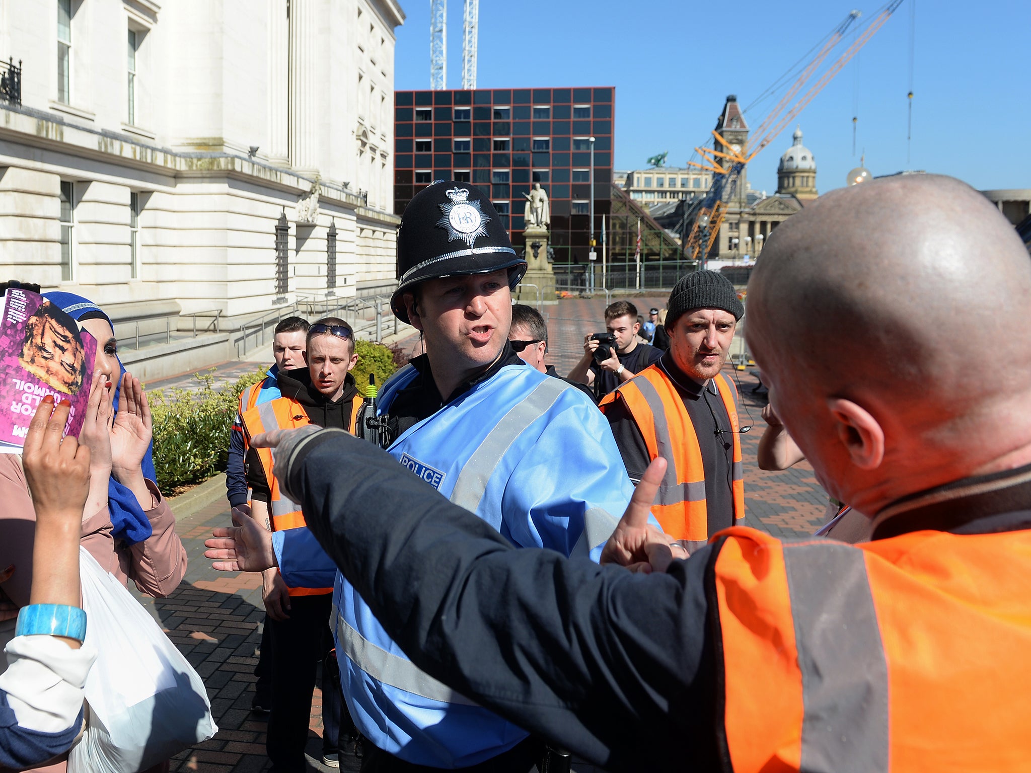 EDL demonstrators remonstrate with anti-fascist protester in Birmingham