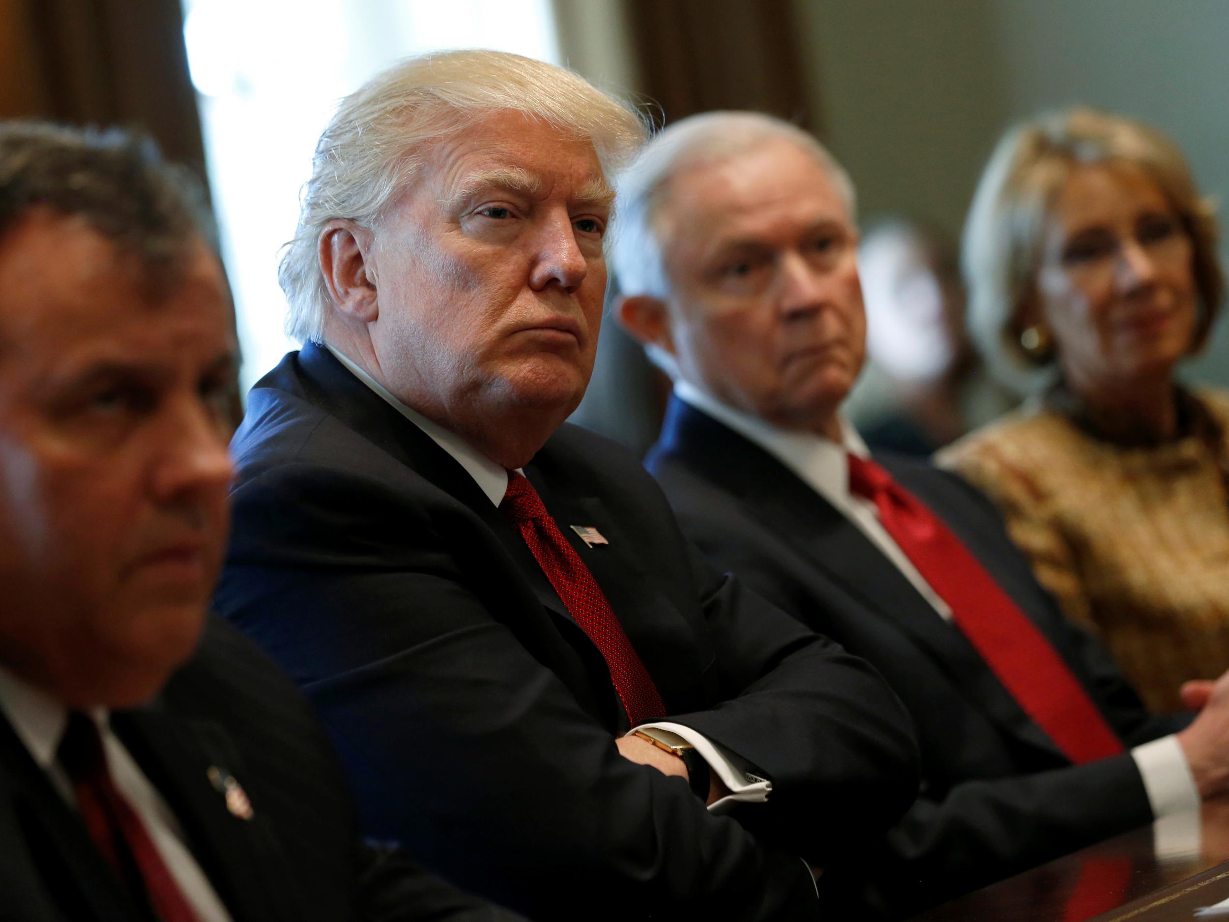 US President Donald Trump, flanked by New Jersey Governor Chris Christie, Attorney General Jeff Sessions and Education Secretary Betsy DeVos, holds an opioid and drug abuse listening session at the White House