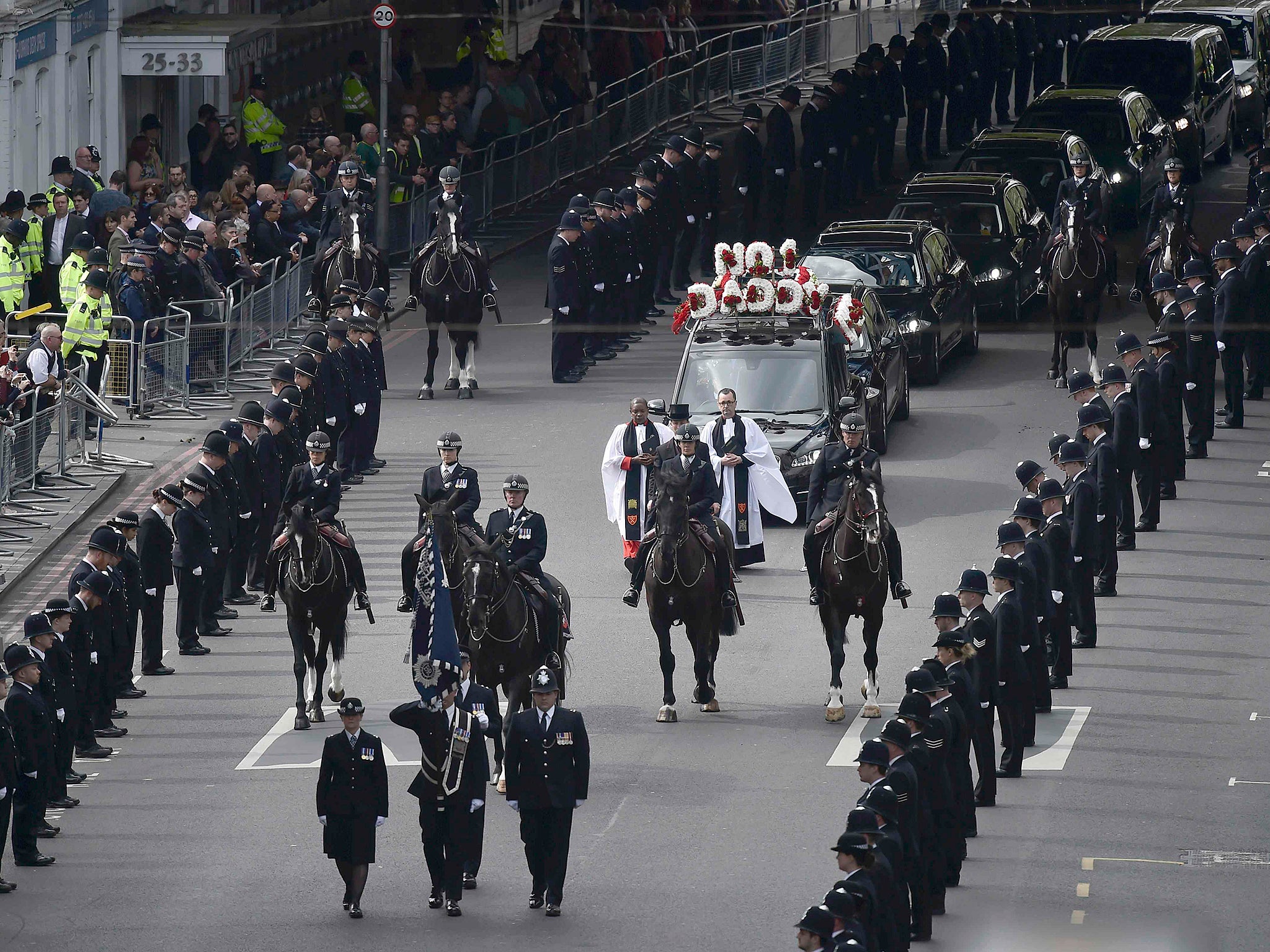 Thousands of police officers lined the two mile route of PC Keith Palmer's funeral cortege through central London