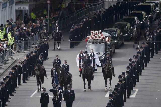 Thousands of police officers lined the two mile route of PC Keith Palmer's funeral cortege through central London 