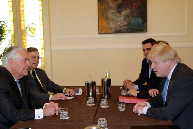 Worlds apart: US Secretary of State Rex Tillerson (L) and the UK's Boris Johnson meet in Italy to discuss Russia and Syria