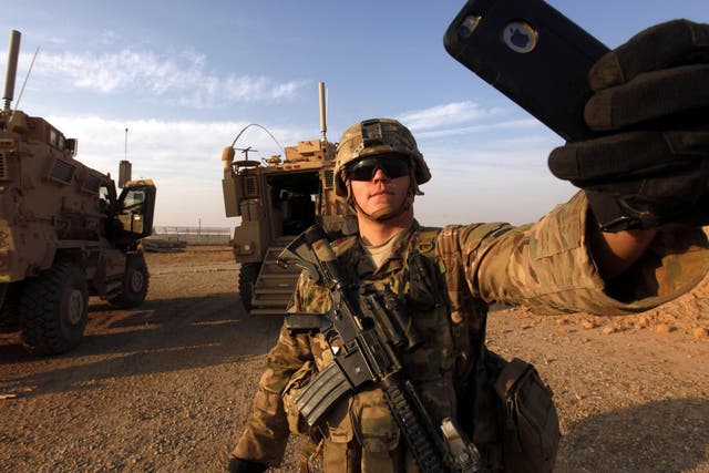 An American soldier takes a selfie at the U.S. army base in Qayyara, south of Mosul October 25, 2016