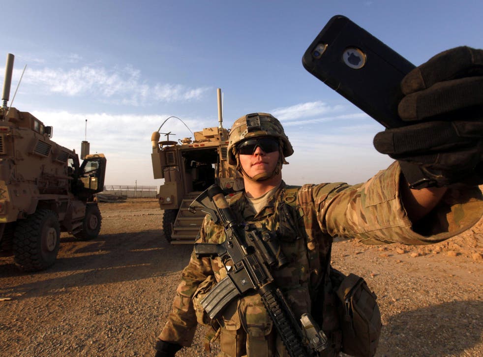 An American soldier takes a selfie at the U.S. army base in Qayyara, south of Mosul October 25, 2016