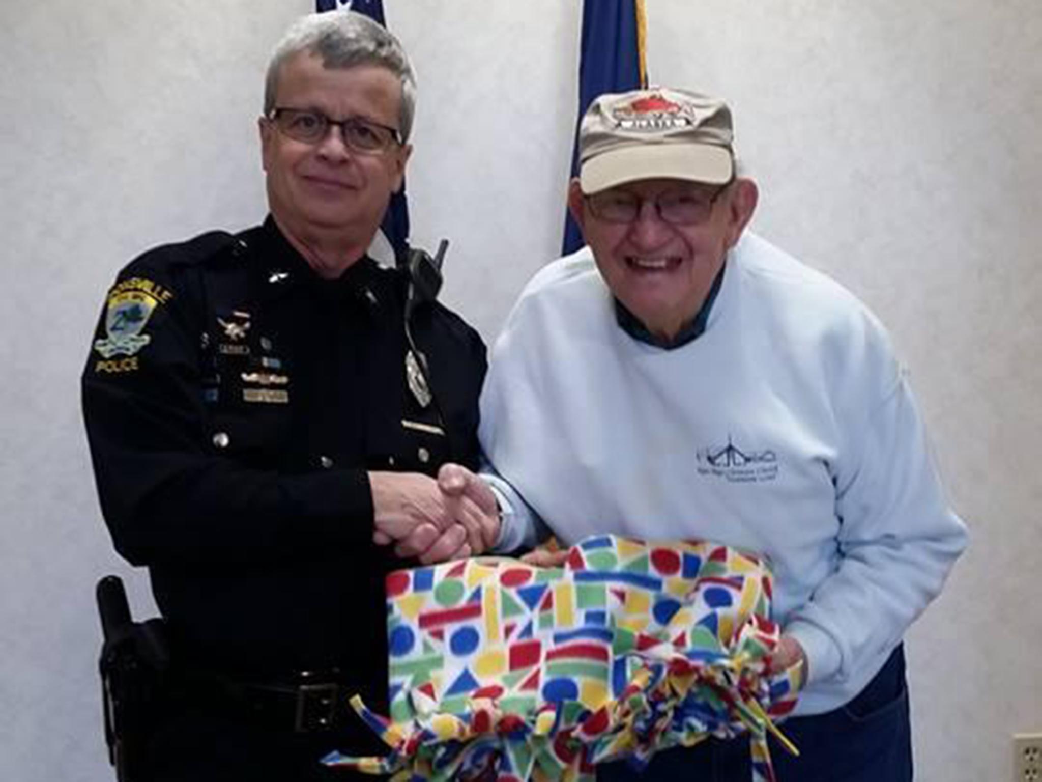 Eighty-eight year-old Clayton Shelburne makes blankets for his local police department.
