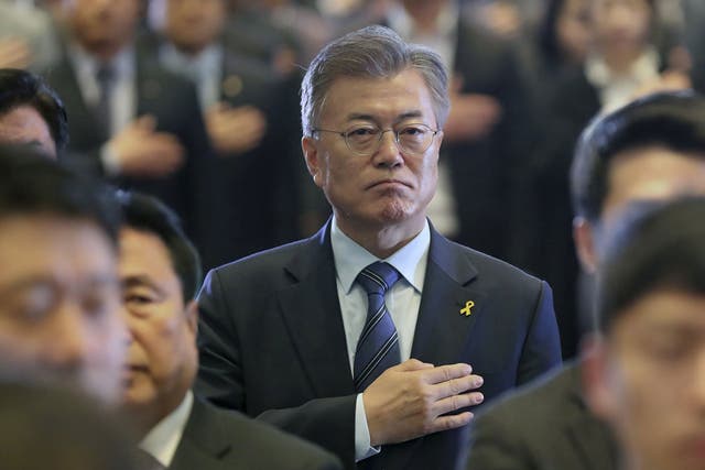 Heart and Seoul: Moon Jae-in, the presidential candidate of the Liberal Democratic Party of Korea, salutes the national flag