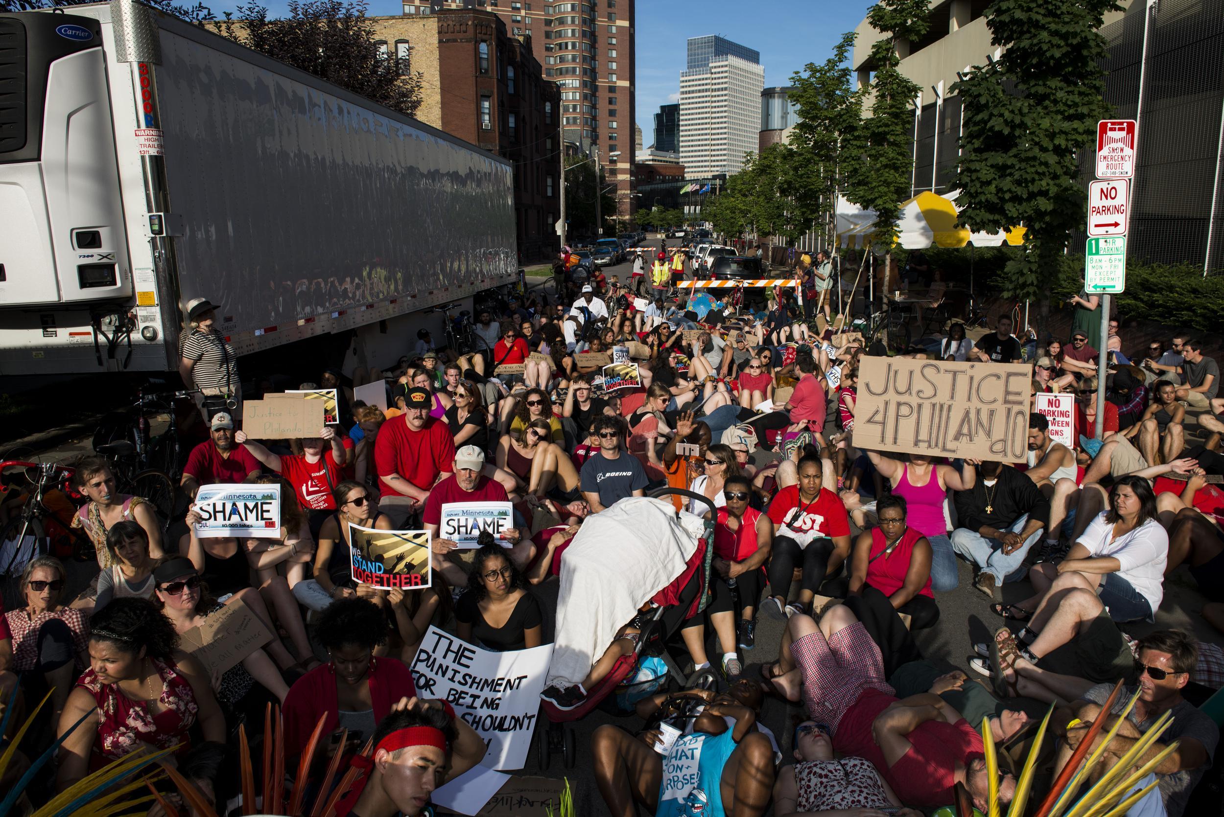 Activists protest the death of Philando Castile on July 9, 2016 in downtown Minneapolis, Minnesota. Protestors were blocked from entering the Basilica Block Party, a music festival in downtown Minneapolis. (Photo by Stephen Maturen/Getty Images)