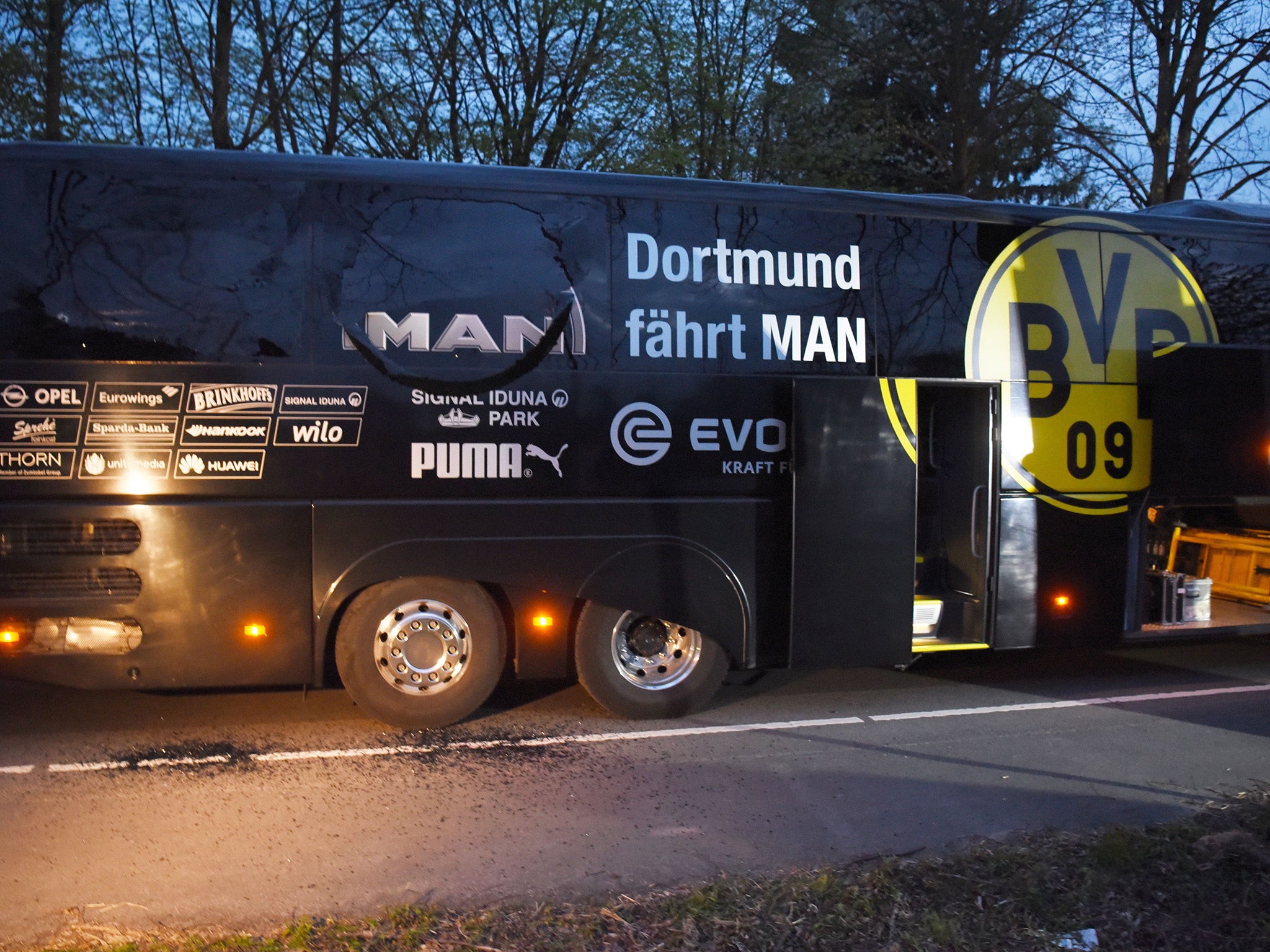 Three explosions went off nearby Dortmund's bus, shattering one window