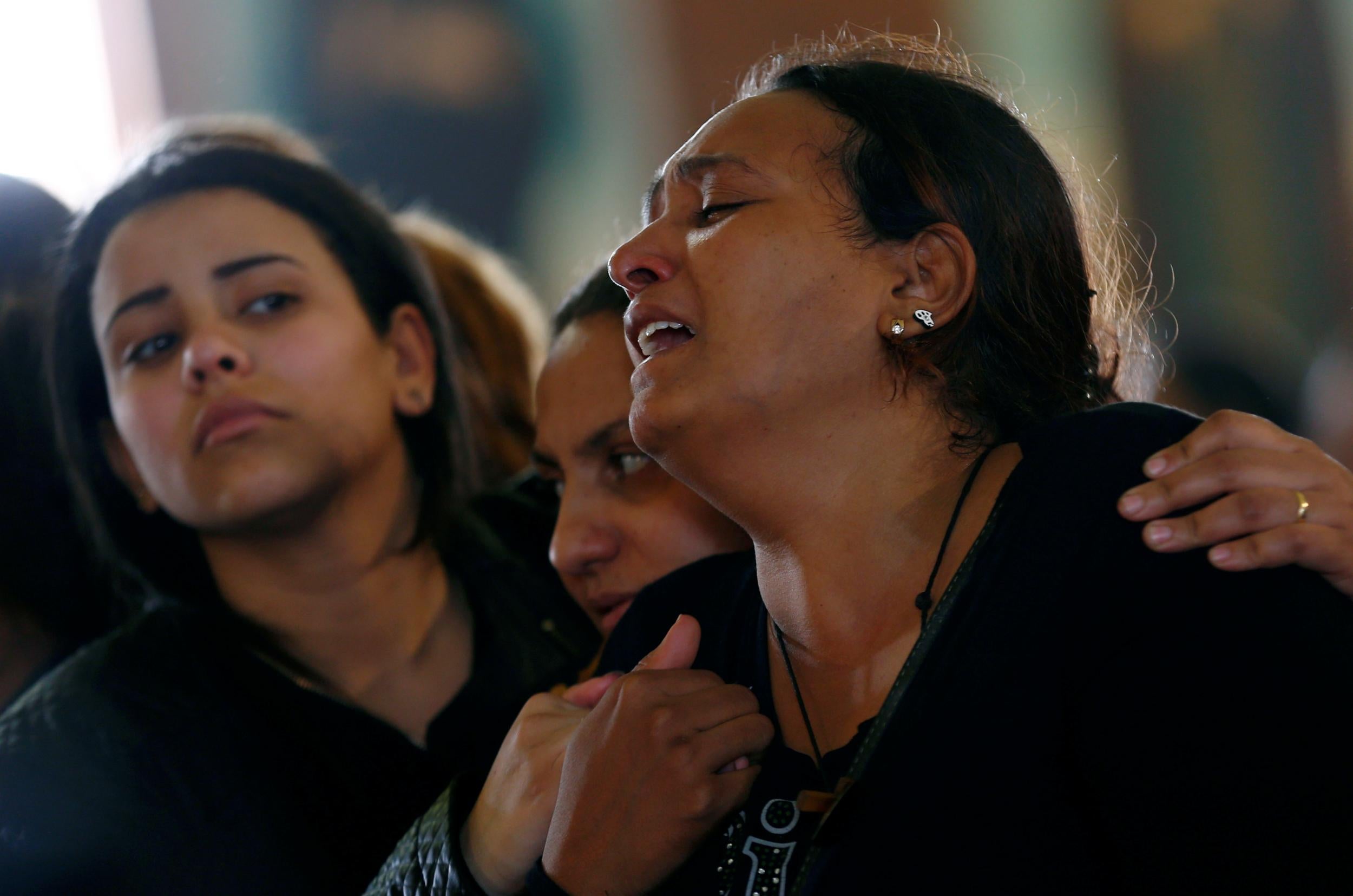 Relatives mourn for the victims of the Palm Sunday bombings during their funeral at the Monastery of Saint Mina in Alexandria, Egypt, on April 10, 2017