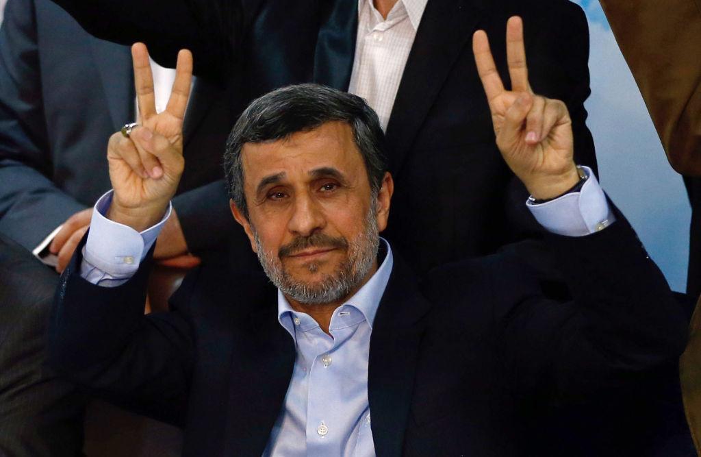 Mahmoud Ahmadinejad flashes the sign for victory at the Interior Ministry’s election headquarters as candidates sign up for the upcoming presidential elections in Tehran on 12 April 2017