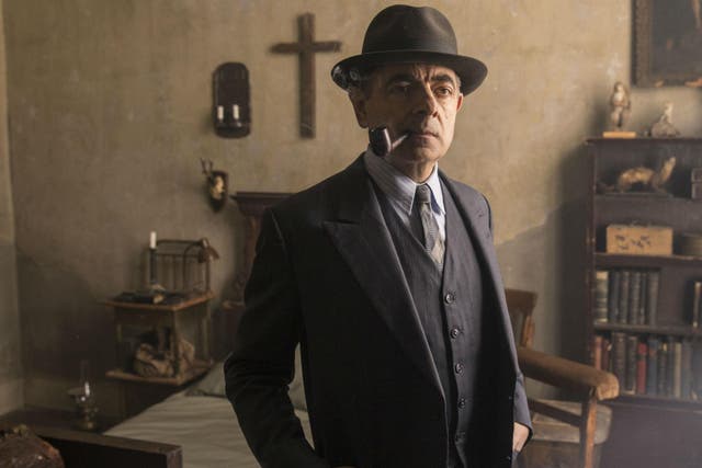 Rowan Atkinson playing the pipe-smoking French detective Maigret in ITV's 'Maigret's Night at the Crossroads'