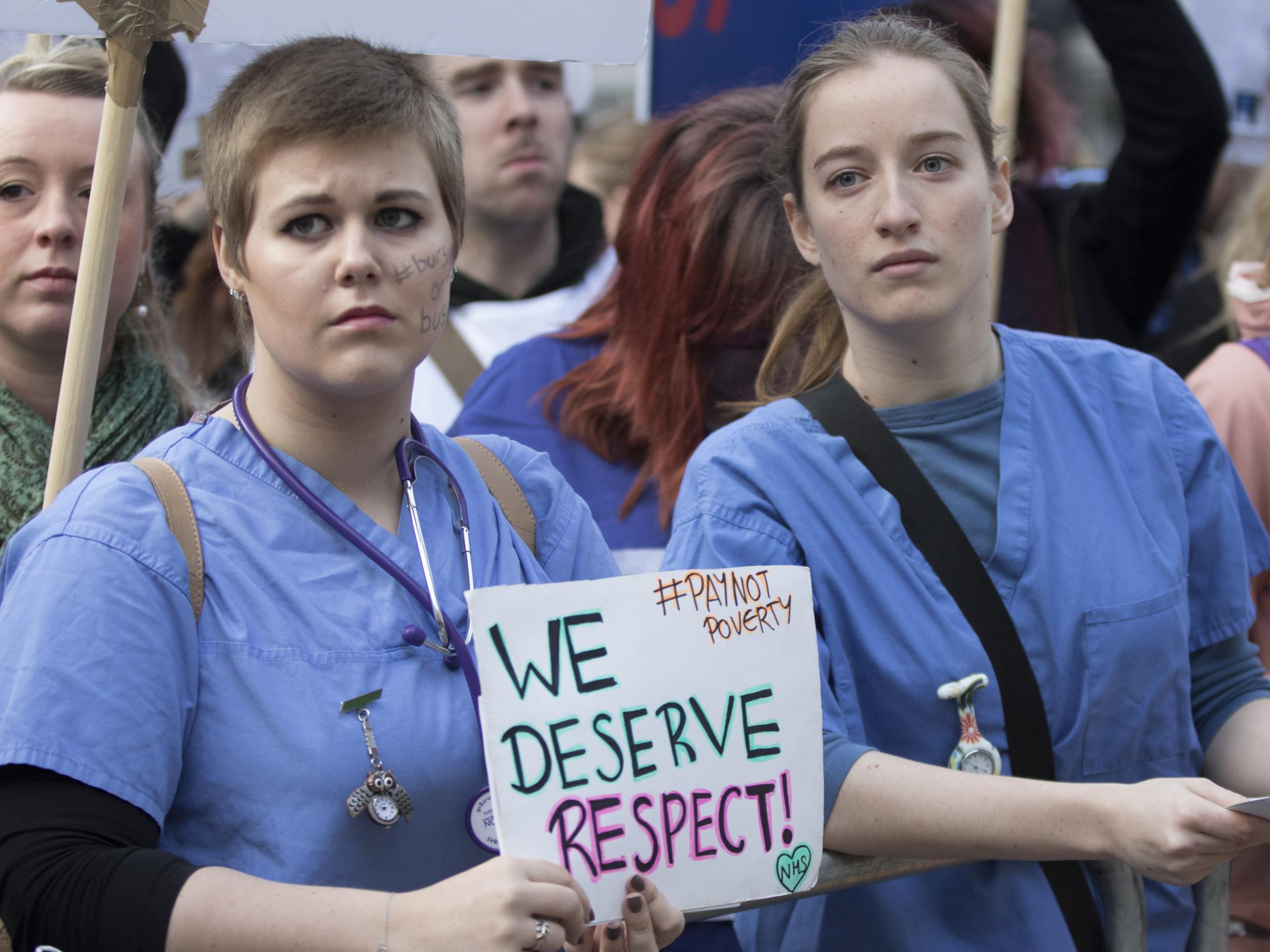 Nurses and midwives have protested over pay and the scrapping of bursaries