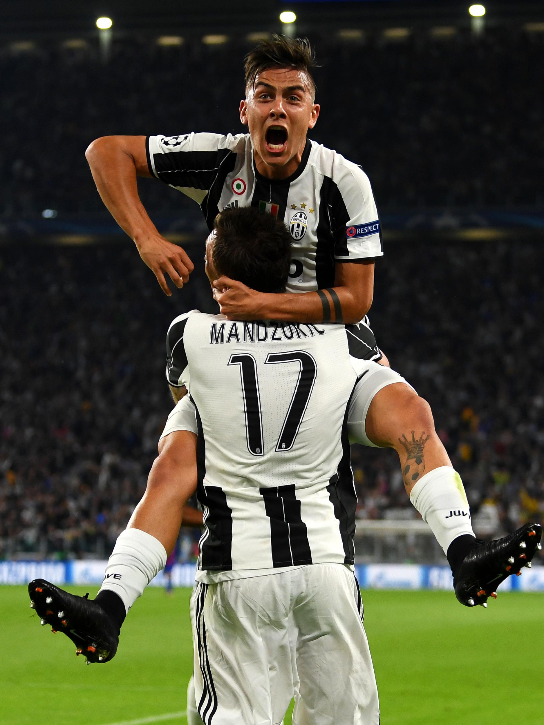 The Argentine celebrates with Mario Mandzukic after scoring his second against Barca