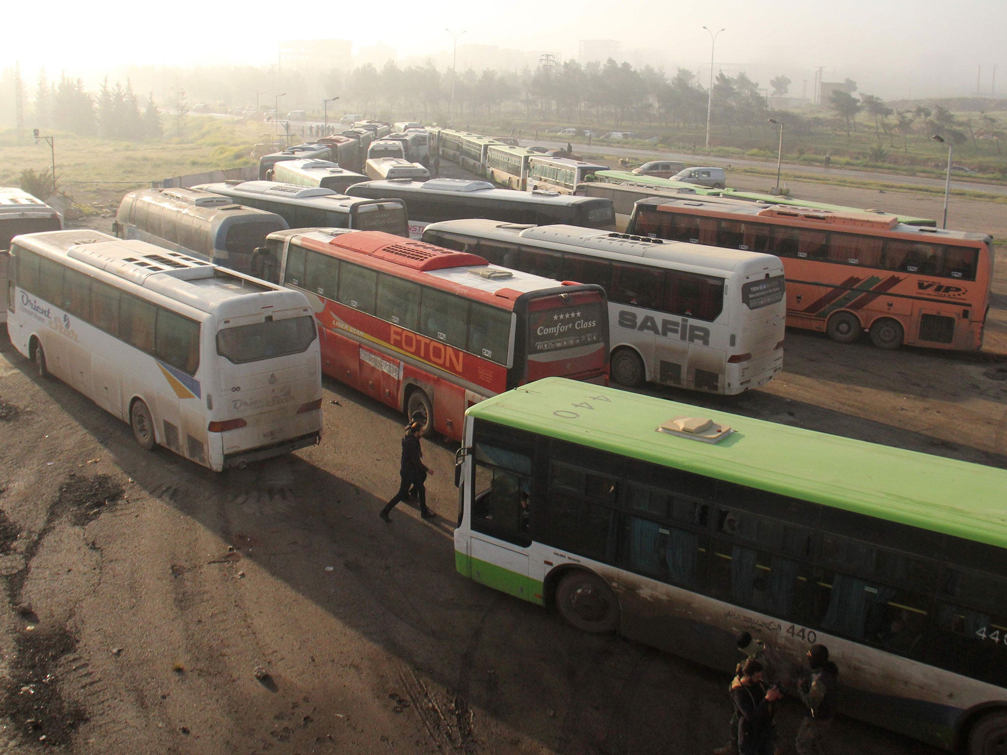 Civilians and fighters began evacuating in the morning