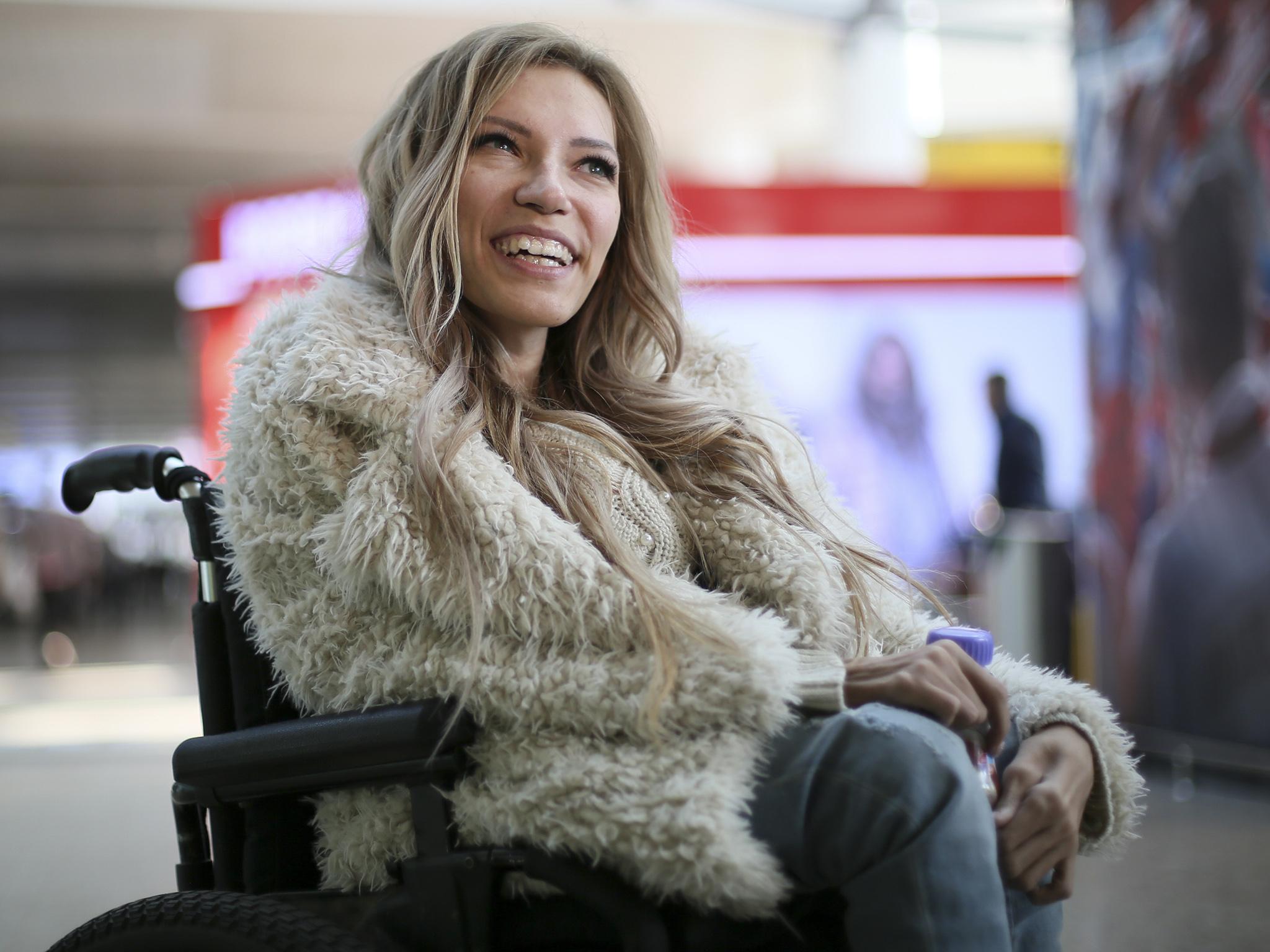 Russian singer Yulia Samoylova who was chosen to represent Russia in the 2017 Eurovision Song Contest, poses while sitting in a wheelchair at Sheremetyevo airport outside Moscow, Russia