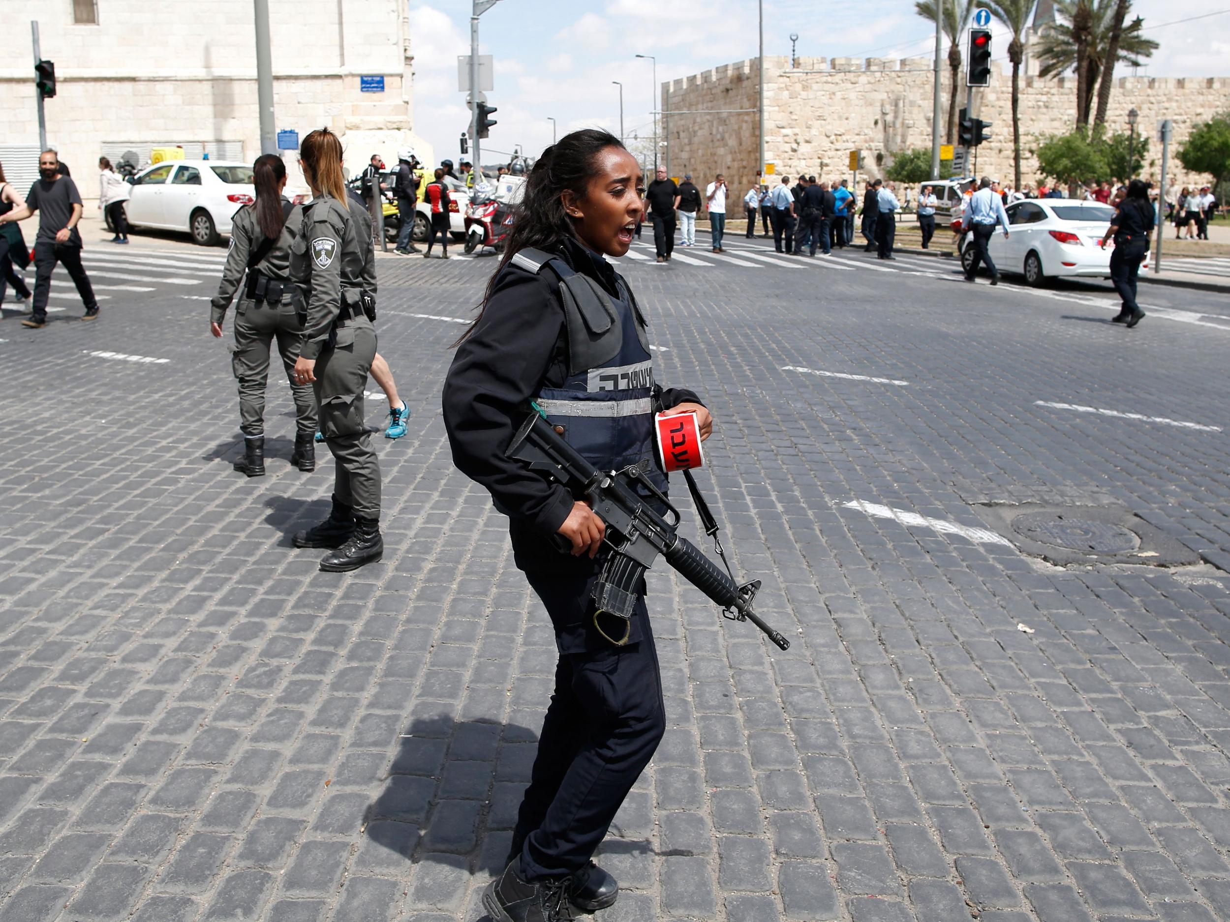 A police officer patrolling the scene after the attack