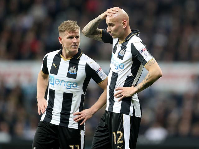 Newcastle football players Matt Ritchie (left) and Jonjo Shelvey react during their game with Leeds
