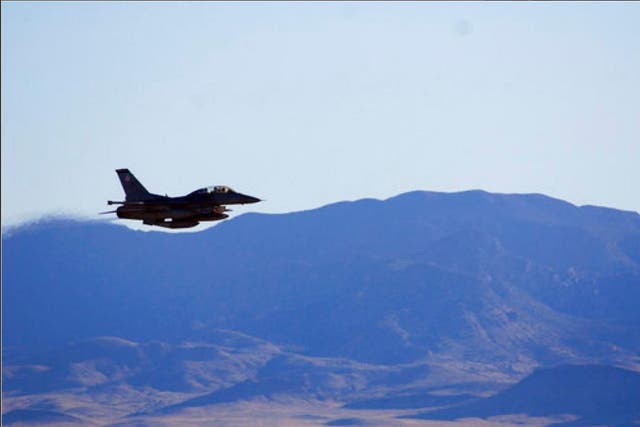 In this March, 2017, photo supplied by Sandia National Laboratories, an F-16C from Nellis Air Force Base in Nevada releases a mock nuclear weapon for a test at Tonopah Test Range near Tonopah, Nev. Scientists at Sandia National Laboratories are claiming success with the first in a new series of test flights that are part of an effort to upgrade one of the nuclear weapons that has been in the U.S. arsenal for decades