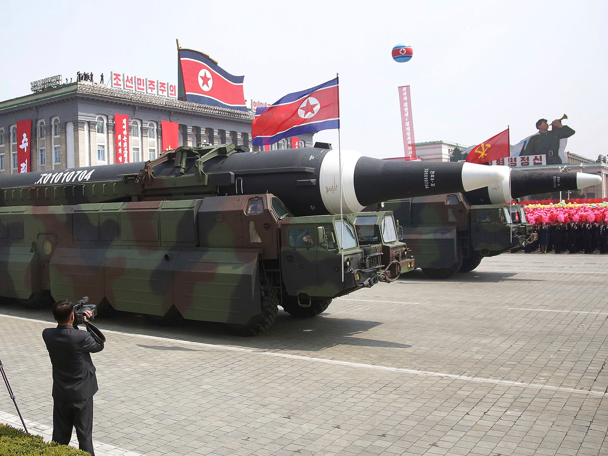 What military experts say appears to be a North Korean KN-08 inter-continental ballistic missile is paraded across Kim Il Sung Square during a military parade on 15 April