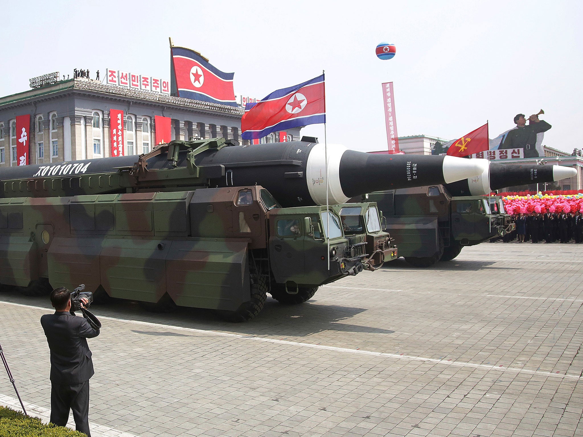 What military experts say appears to be a North Korean KN-08 inter-continental ballistic missile is paraded across Kim Il Sung Square during a military parade on Saturday