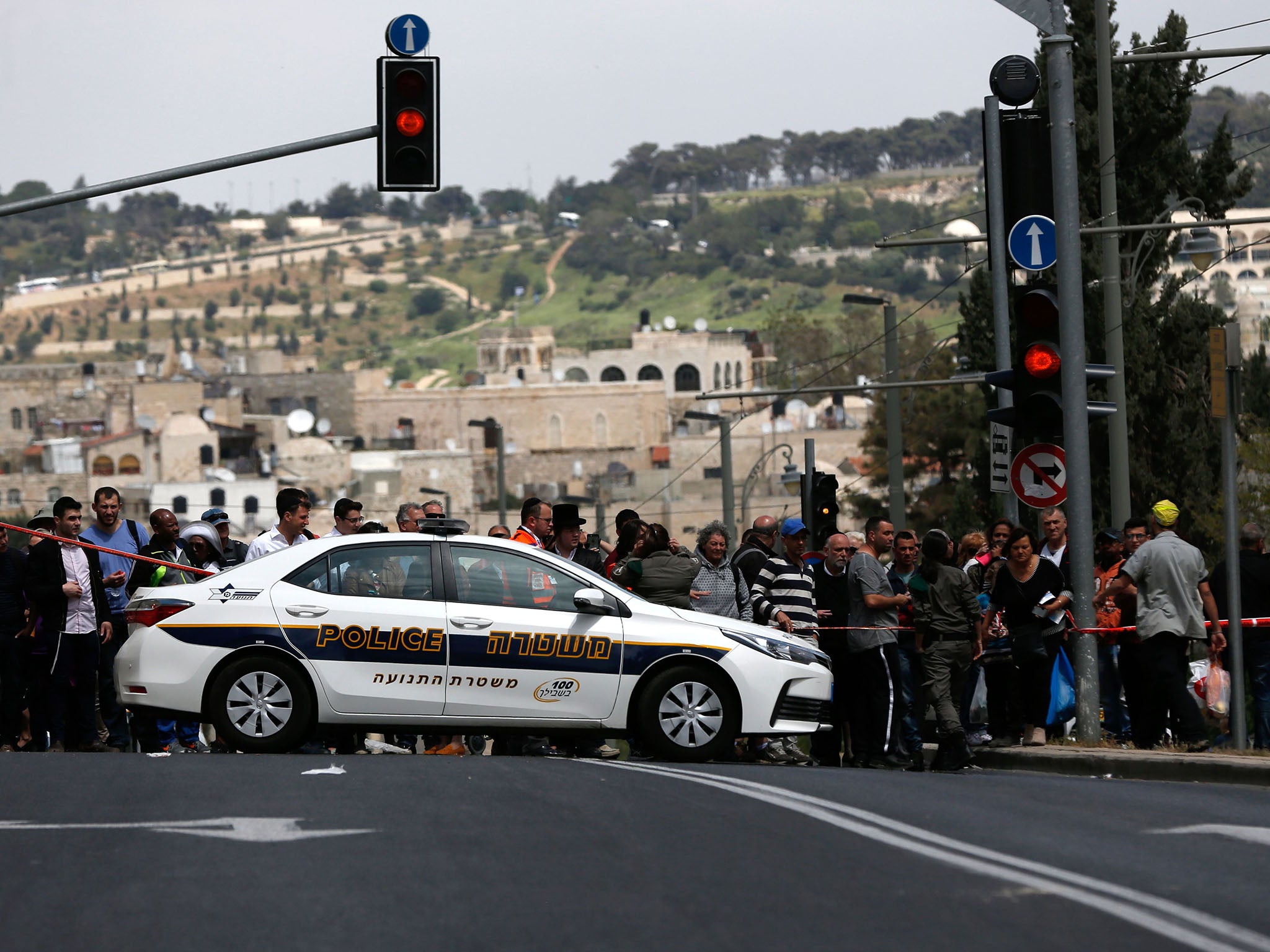 A crowd formed at the scene of the attack. The Old City was packed with people as Jews marked Passover and Christians celebrated Easter