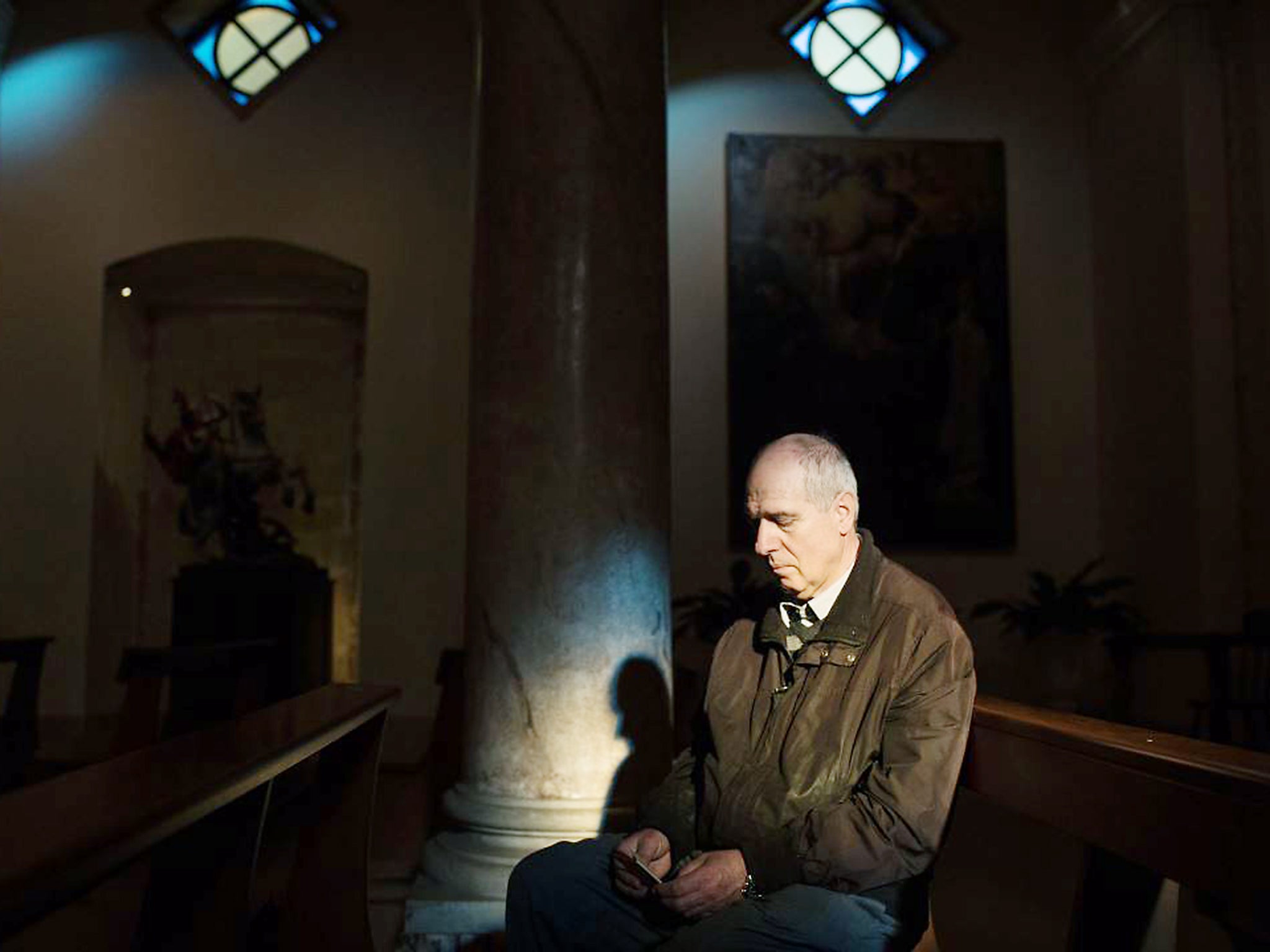 &#13;
Stefano Arcuri at a church in San Giorgio Ionico, in the Apulia region. Mr Arcuri’s wife, Paola Clemente, had a heart attack and died in July 2015 while sorting table grapes at a vineyard&#13;