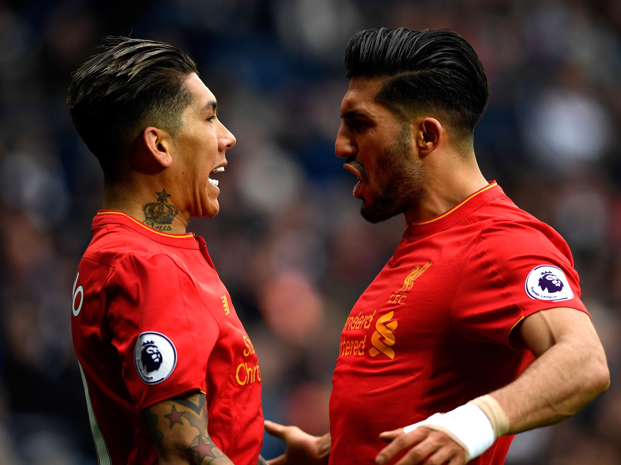 Firmino celebrates with Can after putting Liverpool ahead