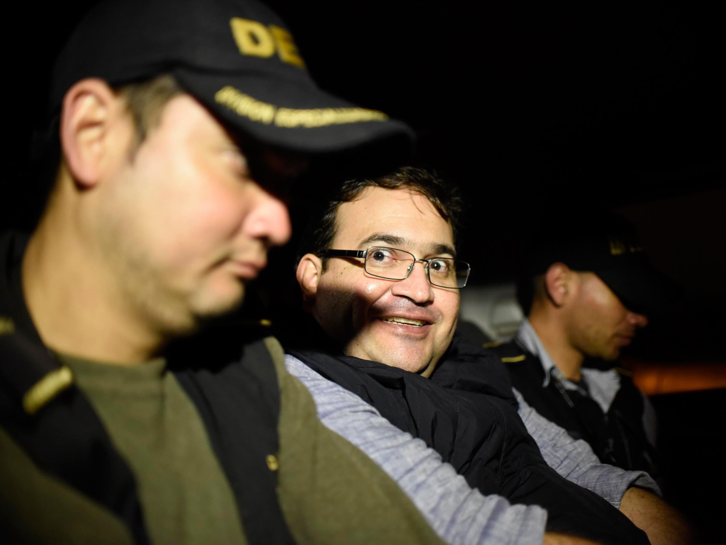 Former Veracruz governor Javier Duarte with officers in Guatemala after six months on the run