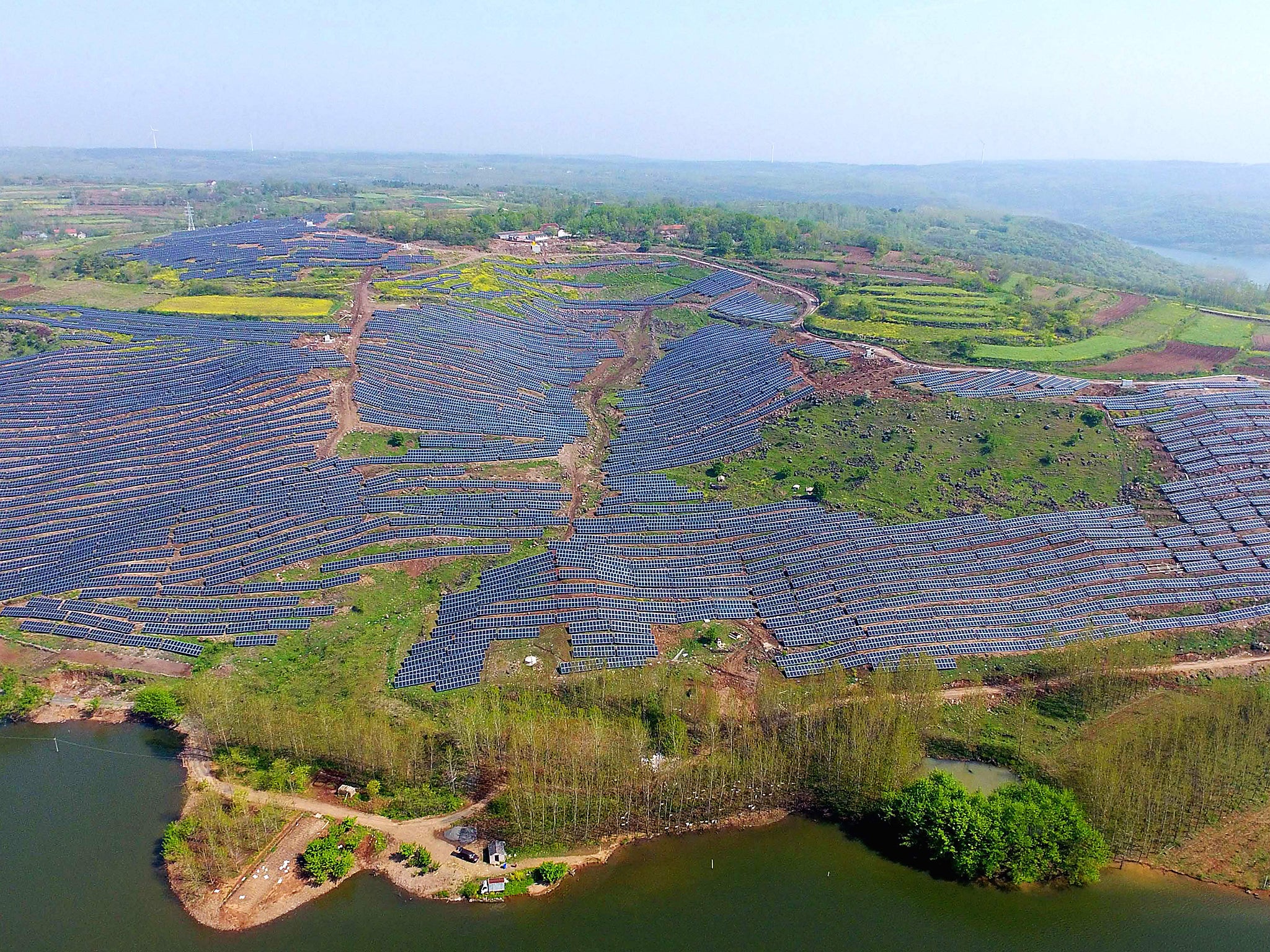 Photovolatic modules on a hillside in China.