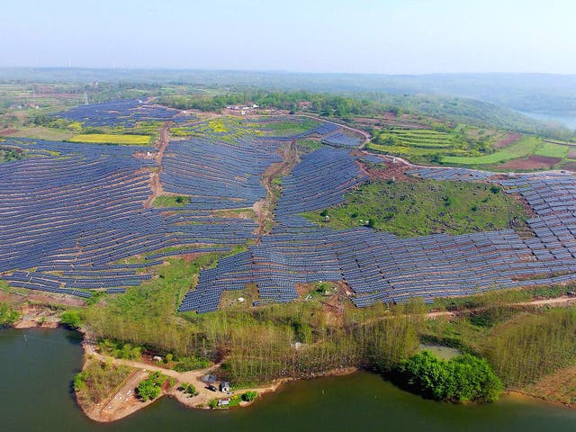 Photovolatic modules on a hillside in China. 