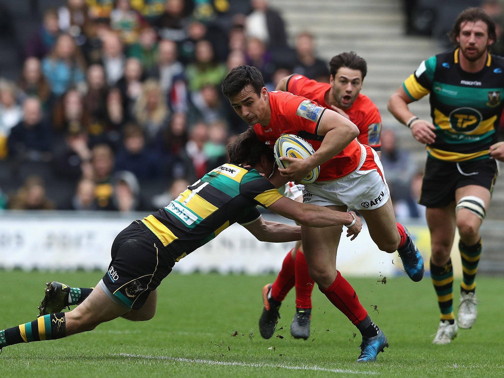 Alex Lozowski breaks with the ball as he tries to avoid Lee Dickson's tackle