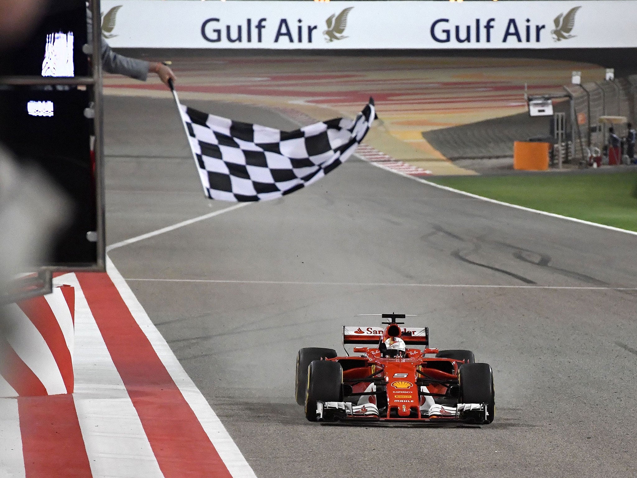 Sebastian Vettel past the chequered flag for victory