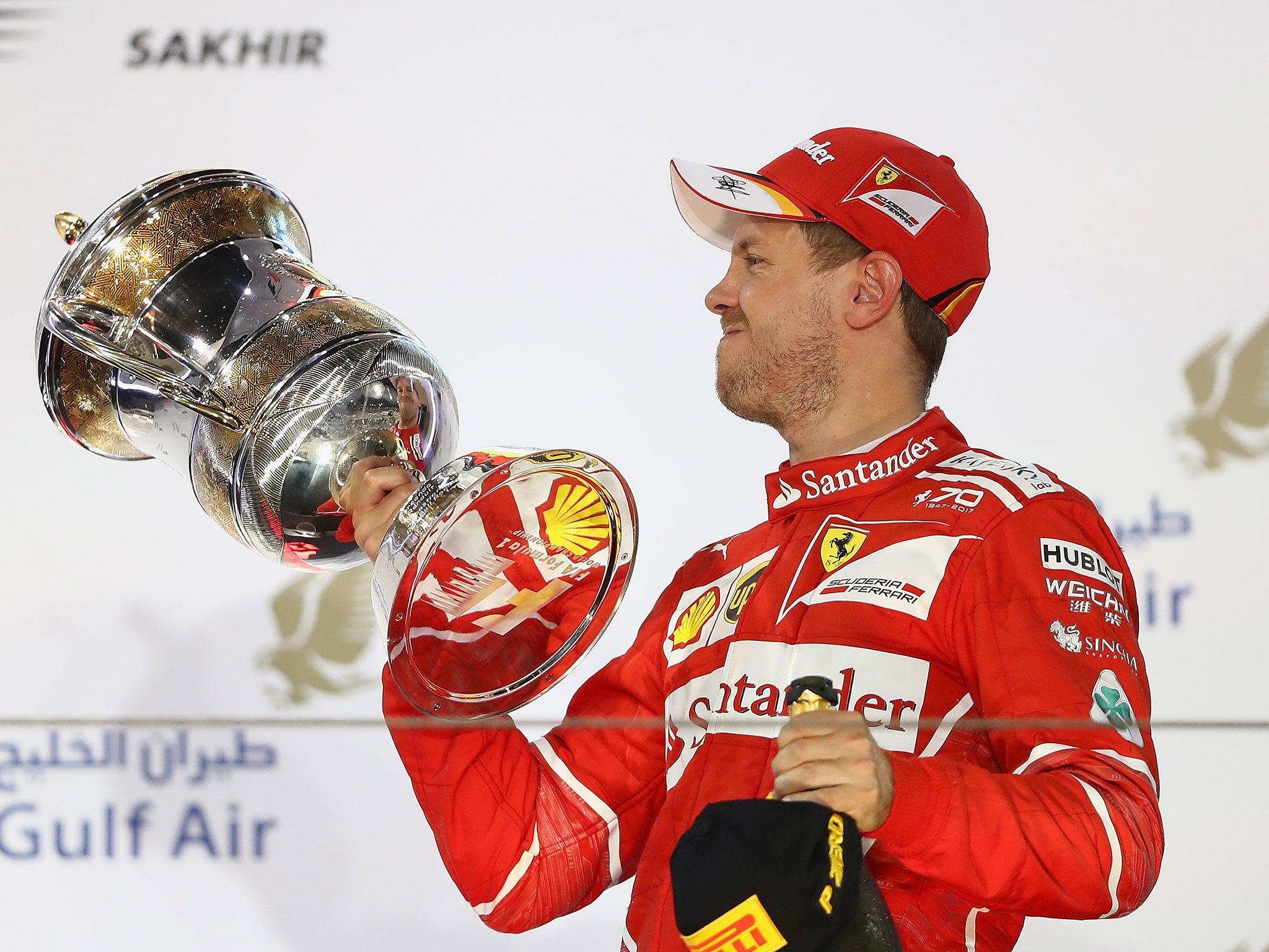 Sebastian Vettel on the podium with his trophy