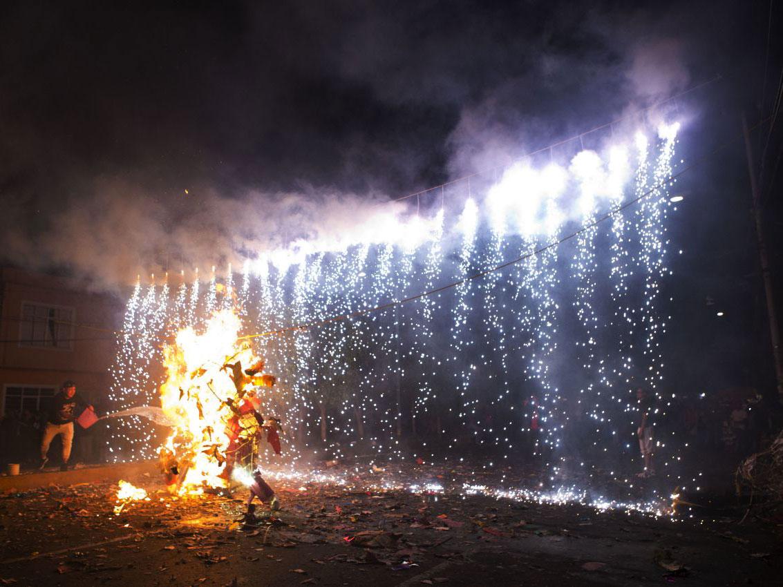 An effigy of Donald Trump is burned