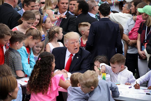 President surrounded by children at the Easter Egg roll event