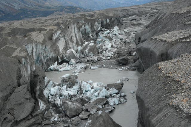 A close-up view of the ice-walled canyon at the end of the Kaskawulsh glacier. This canyon now carries almost all meltwater from the toe of the glacier down the Kaskawulsh Valley, rather than into the Slims River