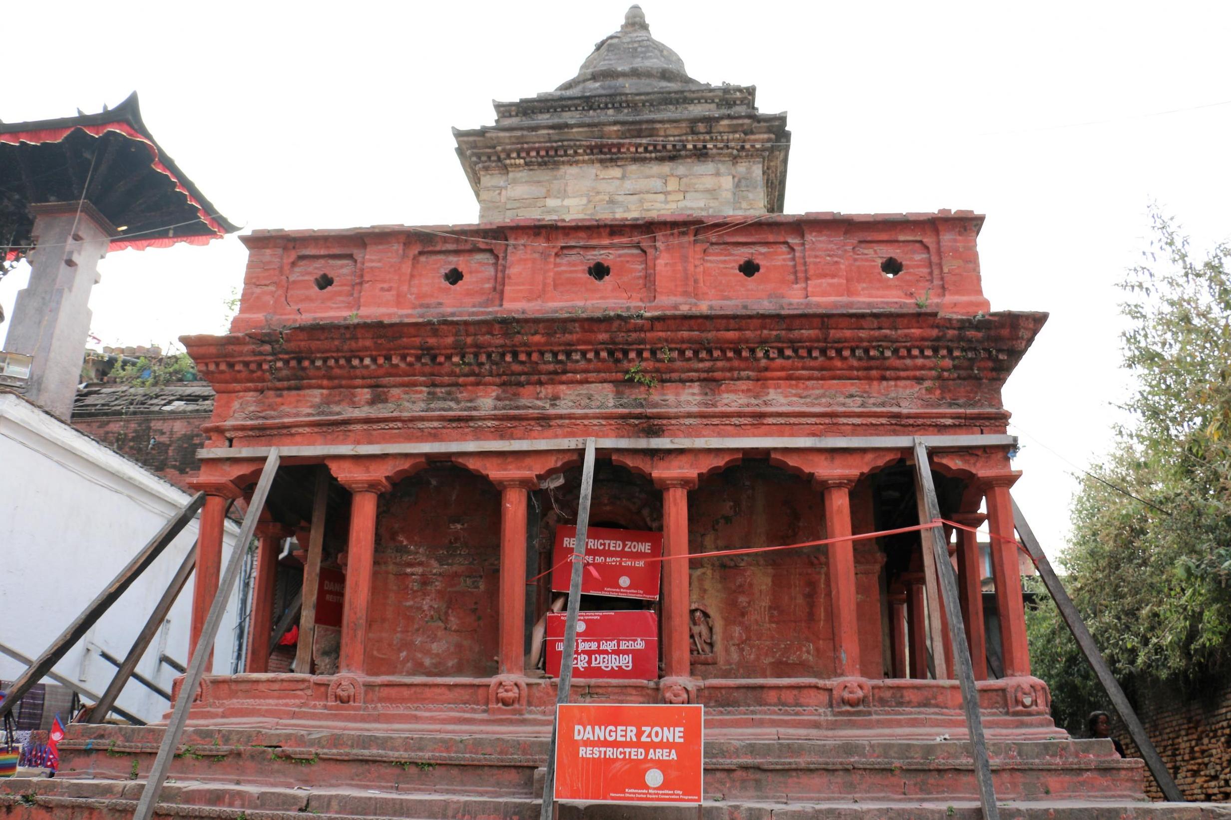 Structures in Nepal are cordoned off behind danger zone signs