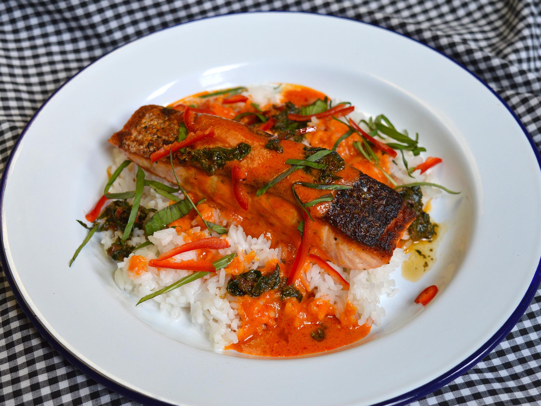 Serve the crispy-skinned salmon with rice, a generous drizzle of sauce, and a spoonful of the ginger, basil and chilli mixture