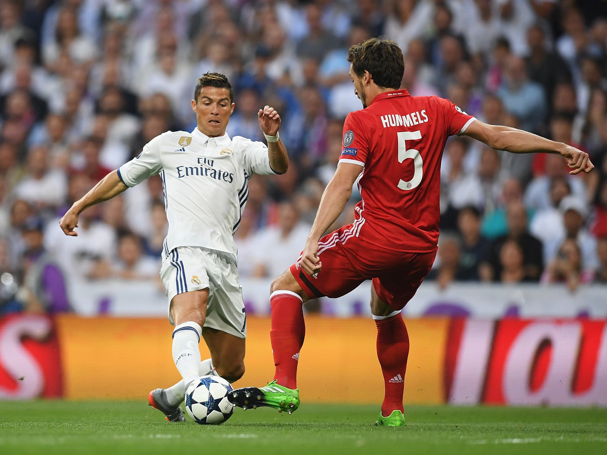 Cristiano Ronaldo and Mats Hummels battle for the ball at the Bernabeu