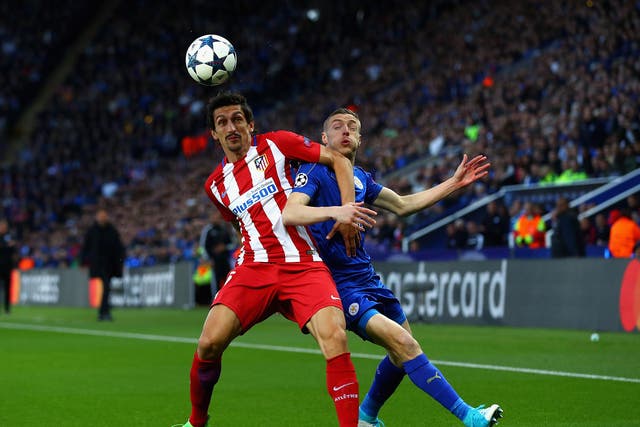 Stefan Savic and Jamie Vardy battle for the ball at the King Power