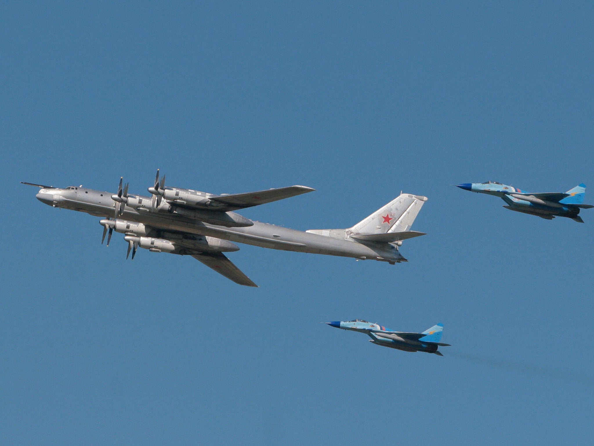 The two bomber planes (not pictured) flew alongside American jets before turning back towards Russia 