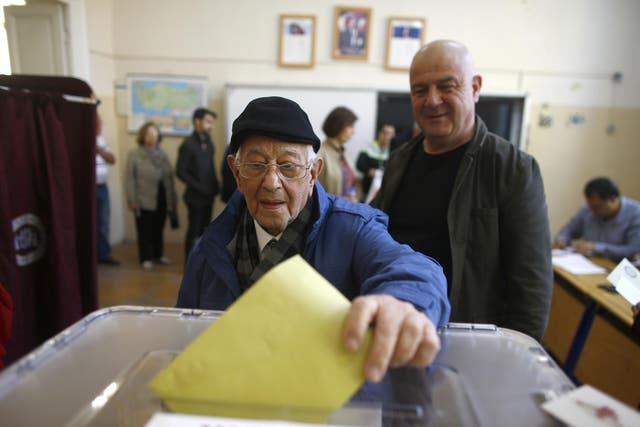 A man casts his ballot at a polling station in Izmir